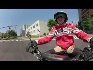 Riding Electric Scooter across Charlotte Uptown